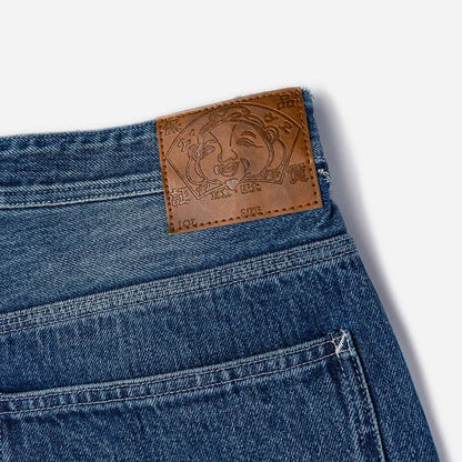 ウォッシュ＆ダメージ大黒プリントリラックスフィットジーンズ:インディゴ